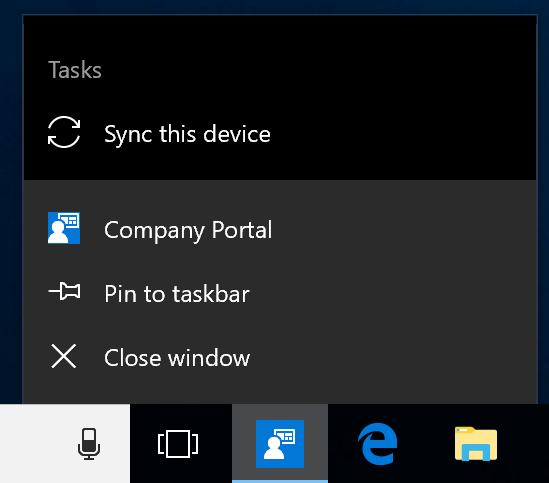 Screenshot of the Windows task bar on a device's desktop. Company Portal app program icon has been clicked to show a menu with options "Pin to taskbar," "Close window," and "Sync this device" action.