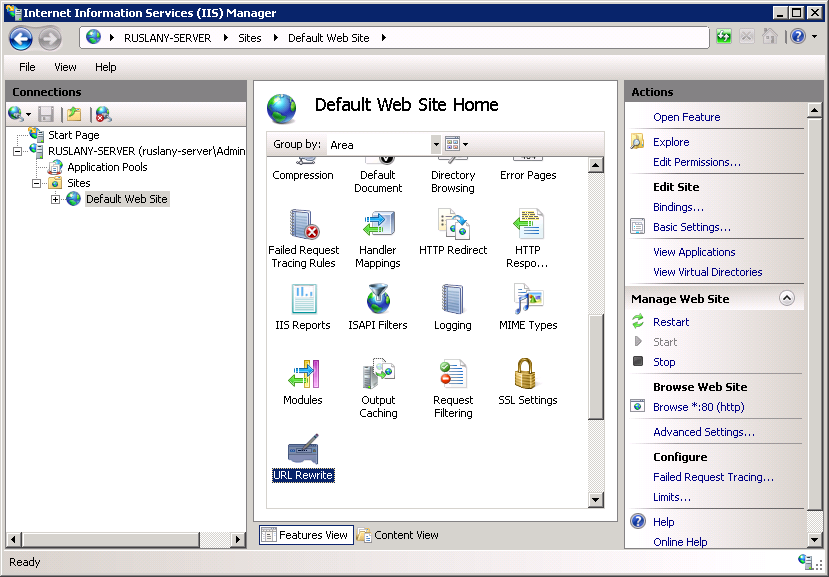 Screenshot of the I I S Manager page. In the Connections pane, Default Web Site is selected. In the Default Web Site Home pane, U R L Rewrite is selected.
