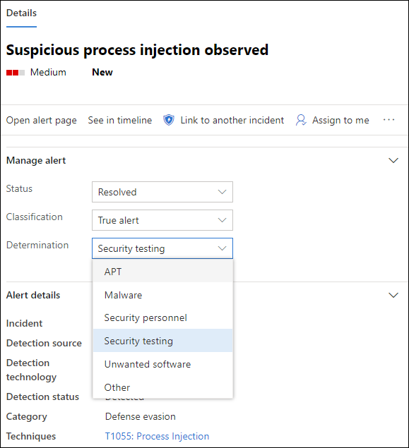The details pane with a resolved alert and the determination drop-down expanded