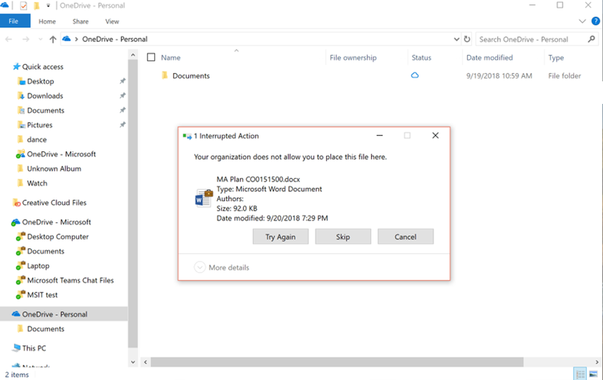 Label-based information protection in Windows 10. A dialog box notifies the user that their organization doesn’t allow placing a file in a personal OneDrive folder.