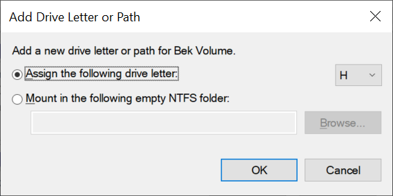 The add drive letter or path dialog box, with the option highlighted to assign the following drive letter.
