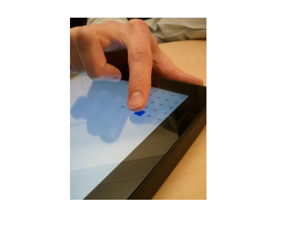 image showing a finger in a natural tapping position during the touch ux test for a windows touchscreen device.