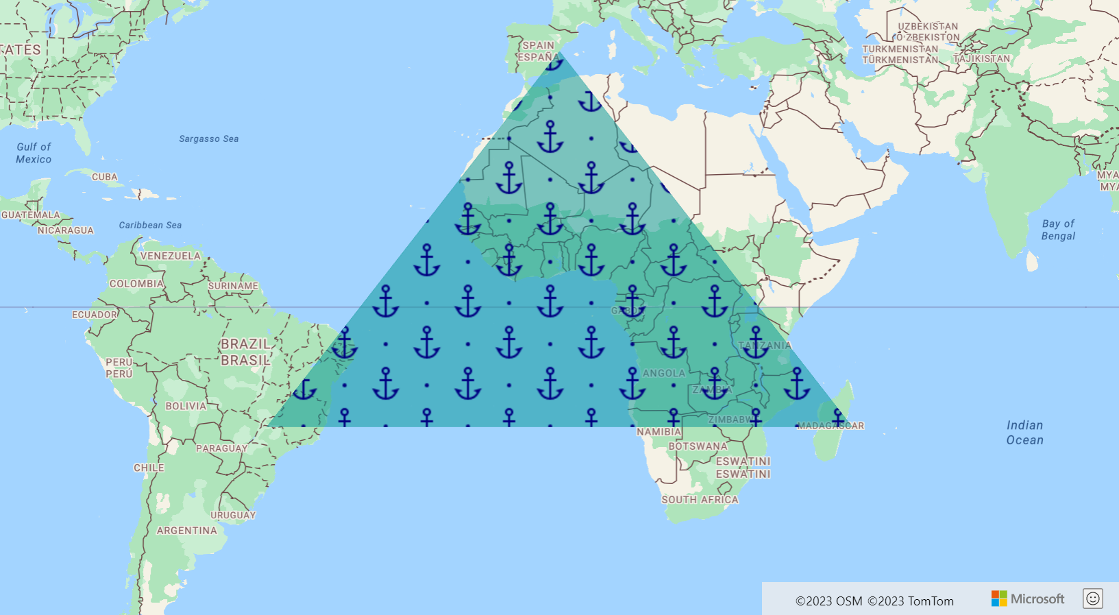 Instantánea de un mapa que muestra una capa poligonal en forma de un gran triángulo verde con múltiples imágenes de anclajes azules en su interior.