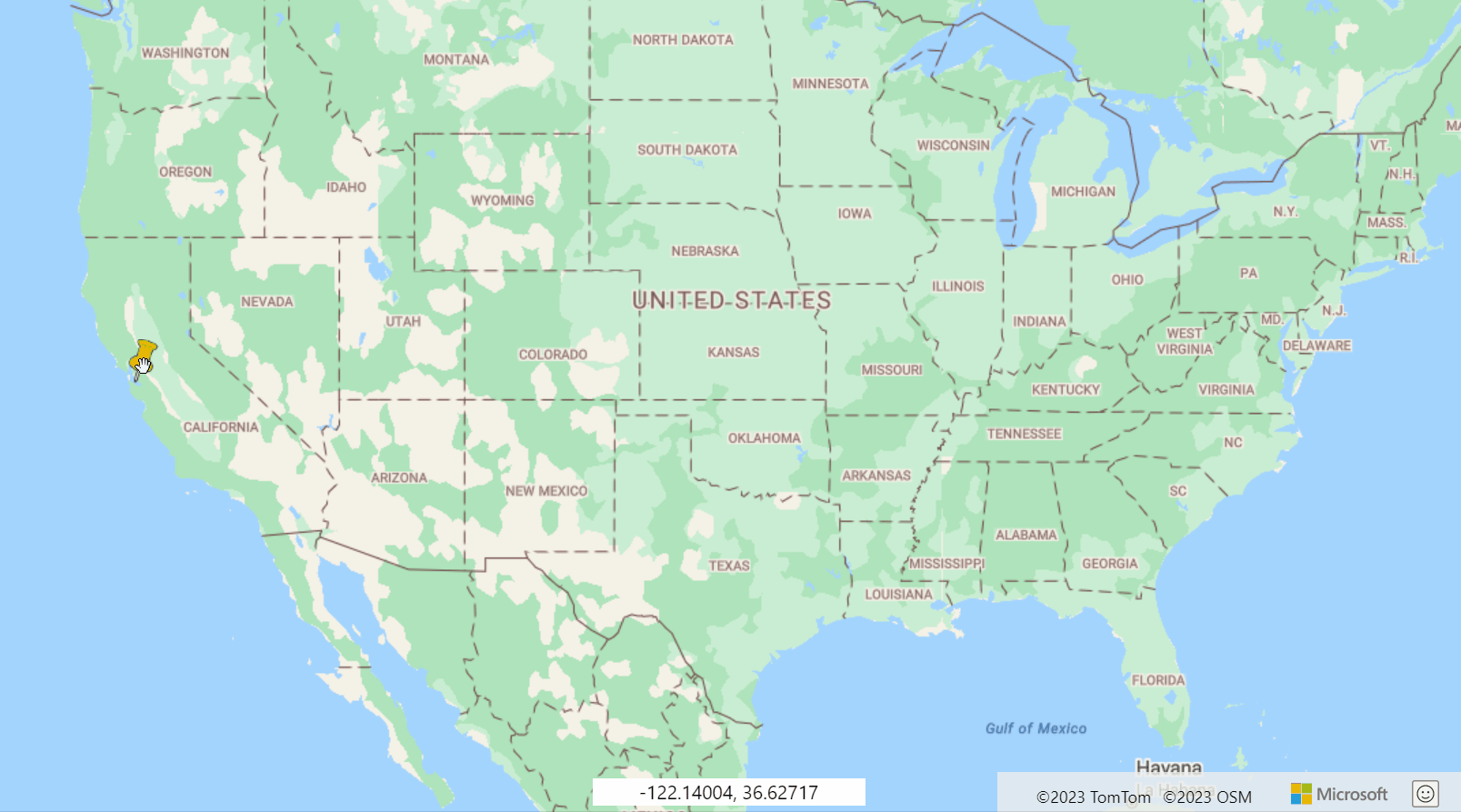 Captura de pantalla en la que se muestra un mapa de Estados Unidos con una chincheta amarilla que se arrastra para mostrar el marcador HTML que se puede arrastrar.