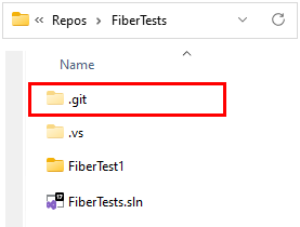 Captura de pantalla de la carpeta de Git, el archivo de omisión de Git y el archivo de atributos de Git en el Explorador de archivos de Windows.