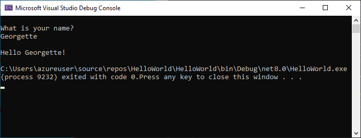 Captura de pantalla de la ventana Consola de depuración que muestra el mensaje de solicitud de un nombre, la entrada y la salida "Hello Georgette!".