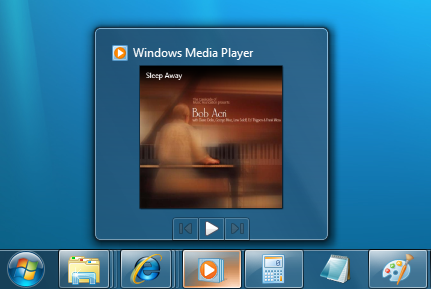 barra de tareas en miniatura para el reproductor de Windows Media, con tres botones: atrás, reproducir y reenviar