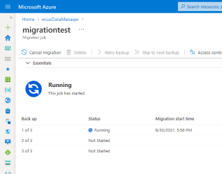 Cuplikan layar bilah pekerjaan migrasi dengan ikon status besar di bagian atas dalam status berjalan.