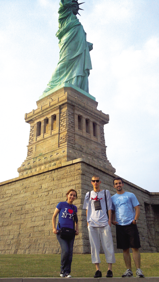 The Members of Team Hawk Stand in Front of the Statue of Liberty