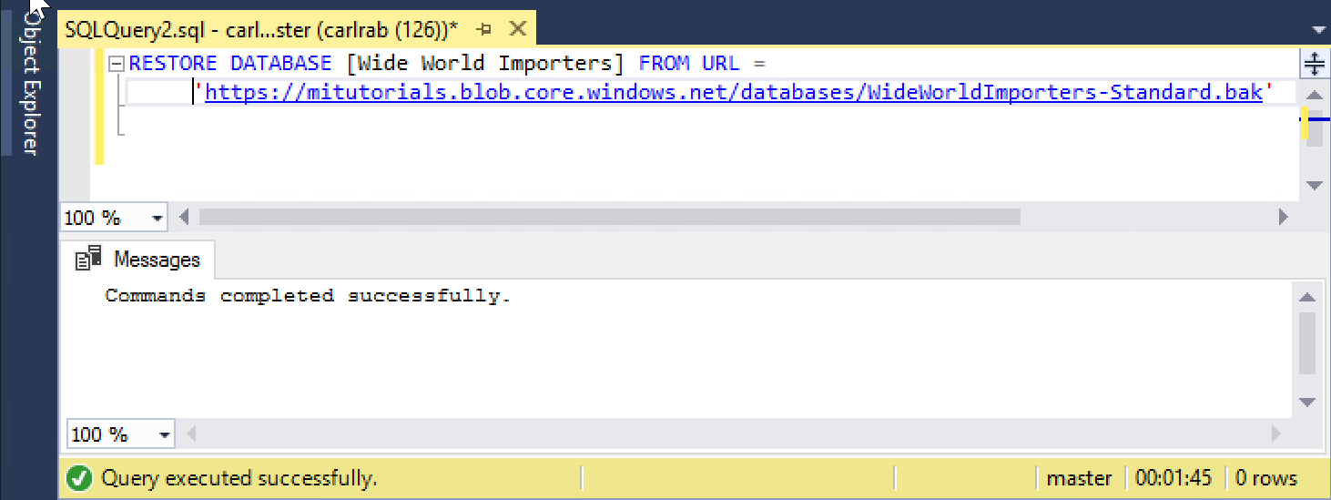 Screenshot that shows the SSMS Query Editor. The RESTORE DATABASE statement is visible, and a message indicates that the query ran successfully.