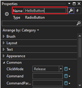 Screenshot of the Properties window for a RadioButton control. The value of the Name property has been changed to HelloButton.