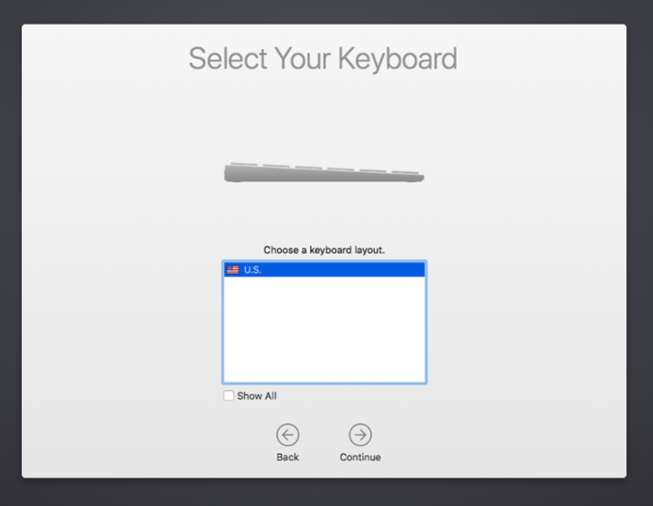 macOS 设备设置助理键盘布局屏幕的屏幕截图，其中显示了要从中进行选择的键盘语言列表、未选中的“全部显示”选项以及“后退并继续”按钮。