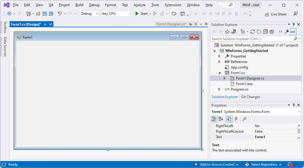 Visual Studio窗口，显示基线 WinForms 项目和窗体设计器。