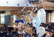 Photo of a man surrounded by confetti